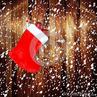 Red christmas boot with gifts on background wooden