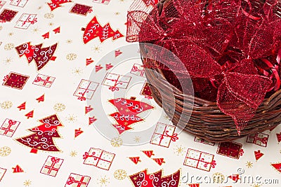 Red christmas ribbons in wicker basket