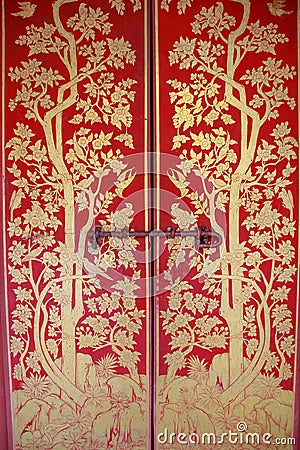Red door with gold painting