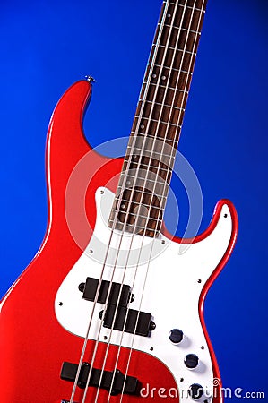 Red Electric Guitar Isolated On Blue