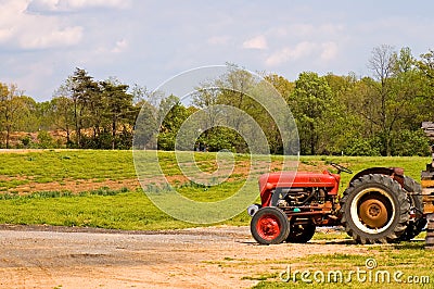 Red farm tractor near field