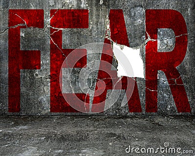 Red fear word on mottled concrete wall with large hole