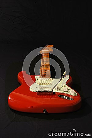 Red Fender copy guitar.