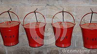 Red Fire Buckets Hanging on Wall