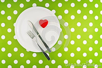 Red heart served on white plate