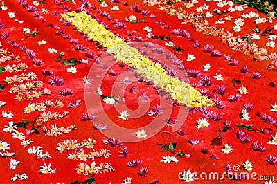 Red Holy Week carpet with flowers