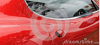 Red italian sports car door handle