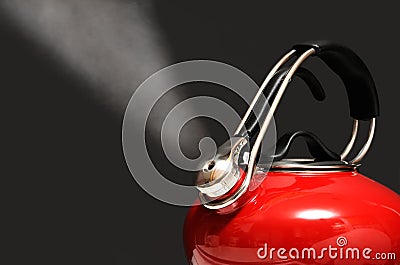 Red Kettle Boiling Isolated on Black