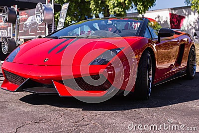 Red Lamborghini on exhibition parking at an annual event Superca