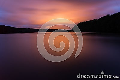 Red light reflex on a lake in a spectacular sunset