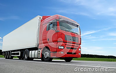 Red lorry with white trailer over blue sky