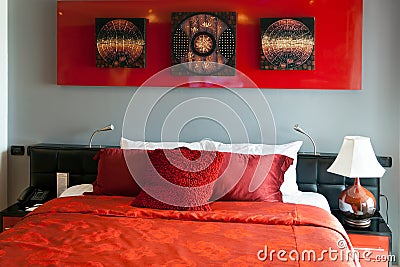 Red luxurious bed in a hotel