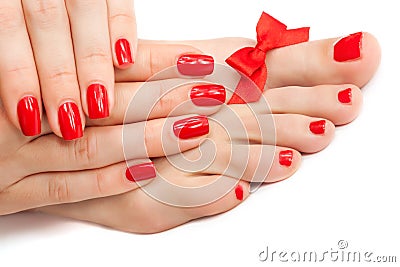Relaxing Red manicure and pedicure with a bow