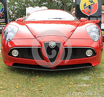 Red modern alfa romeo sports car front