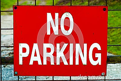 Red NO PARKING sign