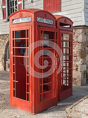 Red phone booth in Antigua for credit cards only