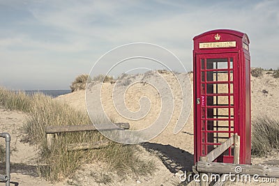 A Red Phone Box on Sand Dunes in Dorset