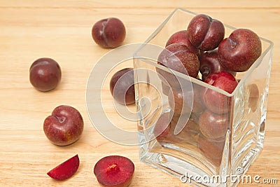 Red plum fruit in glass box