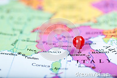 Red push pin on map of Italy