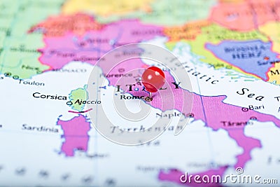 Red push pin on map of Italy