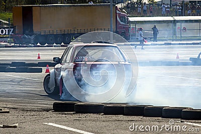 Red racing modified car drifting