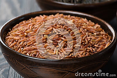 Red rice in ceramic bowl, close-up