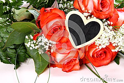 Red roses with writing board in heart shape