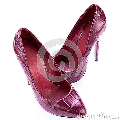 Red stylish leather high heels isolated on white