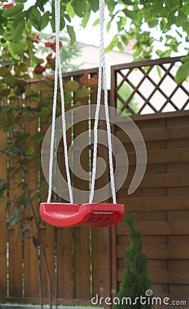 Red swing outdoors