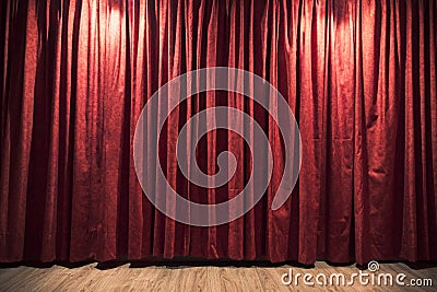 Red theater curtain with a wood stage floor