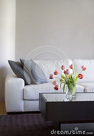 Red tulips in modern living room - home decor