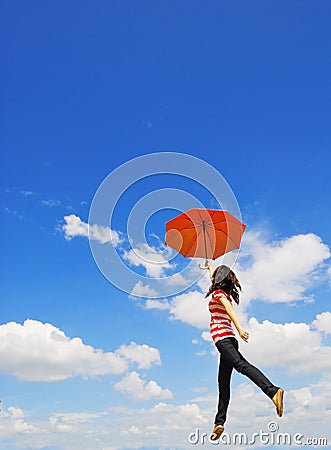 Red umbrella woman jump to sky