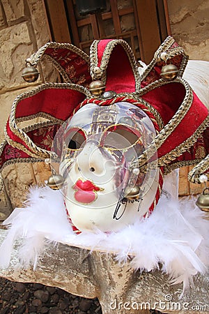 Red Venetia Mask on Rock