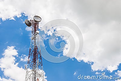 Red and white tower of communications with a lot of different an