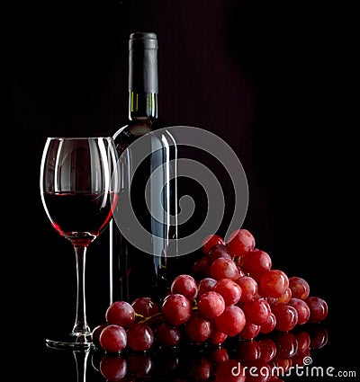 Red wine and grapes