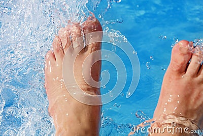 Refreshing the feet in the pool