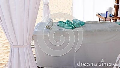 Relaxation concept - massage bed at the beach.