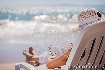 Relaxing and reading at the beach