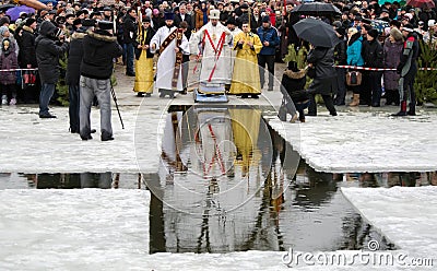 Religion, feast of the Epiphany. The priest blesses the winter the water in the river, in the hole