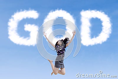 Religious woman jumping with clouds god