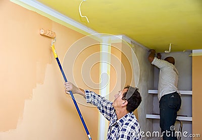 Renovation team painting room