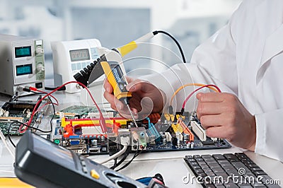 Repairman fixes electronic equipment