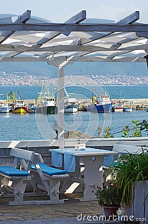 Restaurant by the sea with empty tables