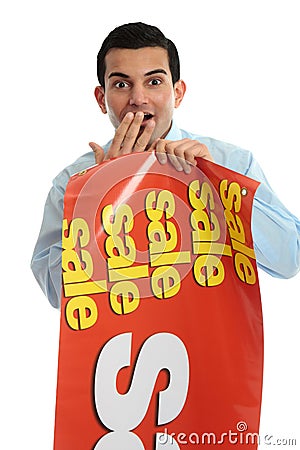 Retail shopkeeper with sale sign,