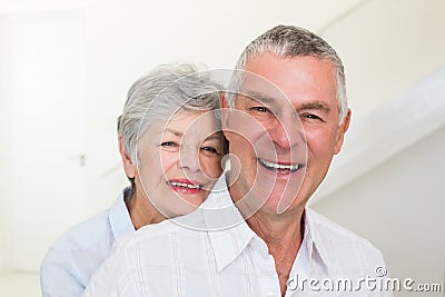 Retired couple smiling at camera