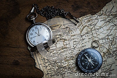 Retro compass and vintage map