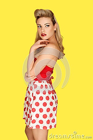 Retro fashion model in red polka dots