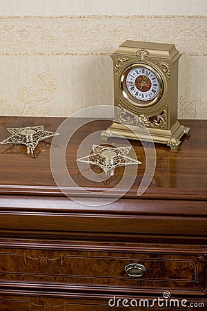 Retro furniture with watch and candles