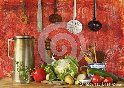 Retro kitchen utensils and vegetables,