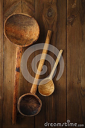 Retro kitchen utensils wood spoon on old wooden table in rustic